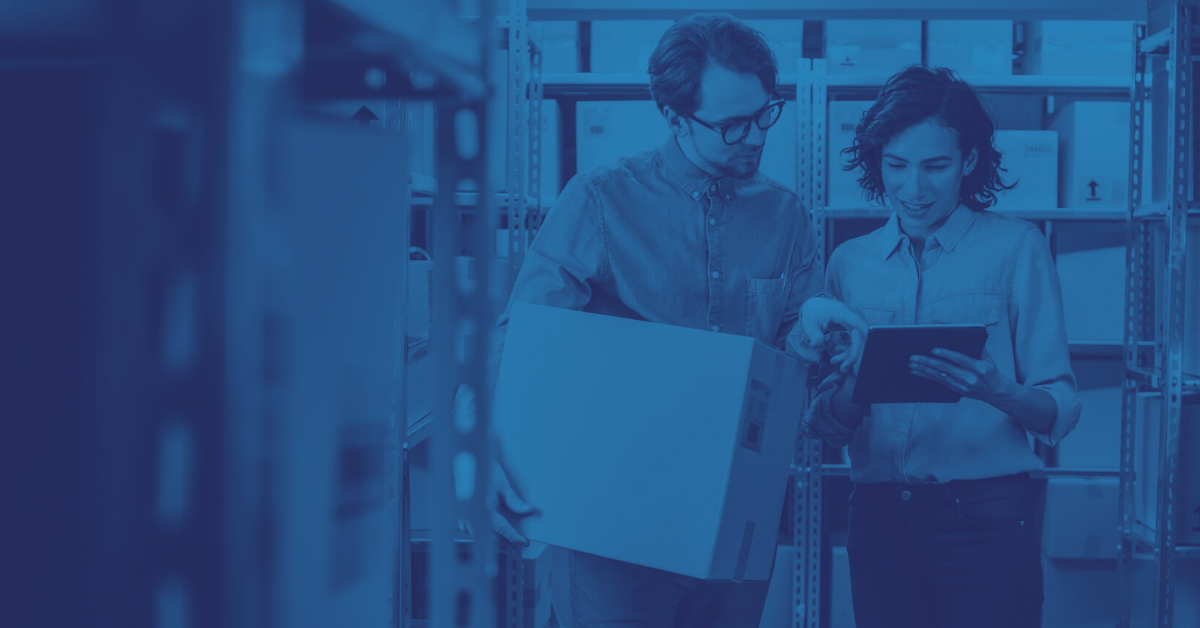 woman and man discussing inventory in warehouse school meals management software