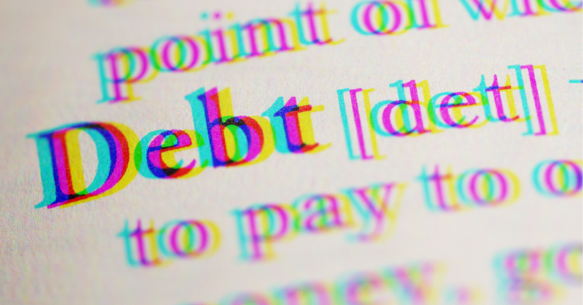 dictionary entry of the word debt super zoomed in student meal debt